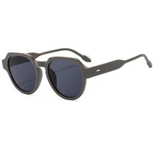 Retro matte polygonal sunglasses with grey lenses and silver stud details on a white background