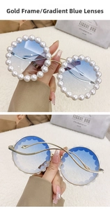 Detail of round luxury sunglasses featuring pearl-studded frames and gradient blue lenses