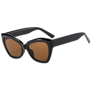 Retro oversized cat-eye sunglasses with thick black frames and brown lenses for women