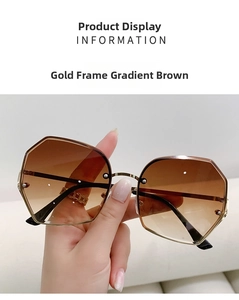 Detail of gold metal frames and gradient tea lenses with stud accents on sunglasses