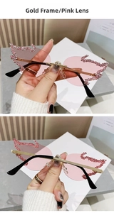 Detail of pink flame rimless sunglasses with gold frame and sparkling rhinestones