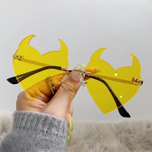 Fashionable rimless heart sunglasses with yellow lenses and unique devil horn frame design