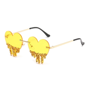 Fashionable heart shaped sunglasses with gold crystal tear drops and metal frame