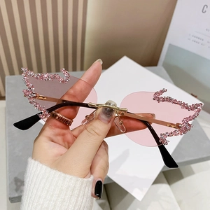 Frameless flame sunglasses with pink gradient lenses and rhinestones for party wear