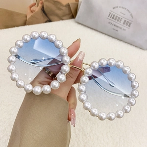 Luxury round oversized sunglasses with gradient blue lenses and pearl-embellished gold frame