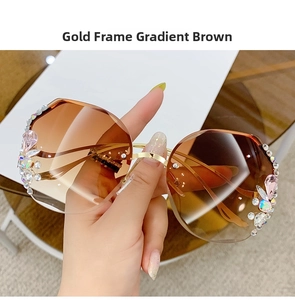 Detail of luxury gold frame gradient brown sunglasses with sparkling rhinestone crystals