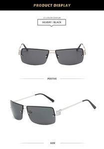 Close-up of rimless oval sunglasses with silver metal geometric temples and black lenses