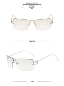 Detailed view of silvery metal frameless sunglasses with white temples and side display