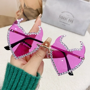 Frameless purple bat wing sunglasses with sparkling rhinestones and golden metal frame