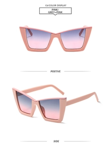 Detail view of pink cat-eye sunglasses with gradient lenses and stylish V-shape design