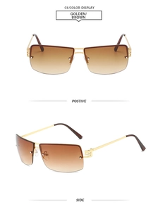Detail of rimless oval sunglasses with golden metal frame and brown gradient lenses