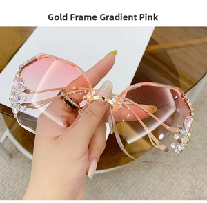 Detailed close-up of gold metal temples and gradient pink lenses with crystal embellishments