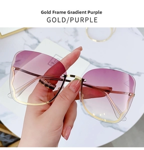 Detailed view of fashion rimless sunglasses with gold frame and purple gradient lenses