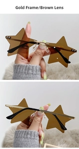 Detail view of rimless star-shaped sunglasses with gold frames and brown lenses