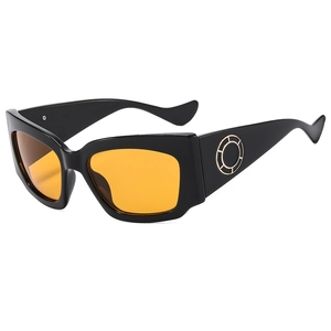 Lunettes de soleil larges modernes avec verres orange et détails dorés aux branches