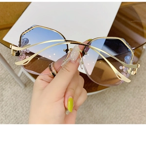 Macro shot of gradient blue-brown lenses with elegant purple bead accents on gold frame