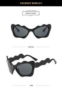 Detailed front and side view of black wavy frame sunglasses with continuous scalloped edges