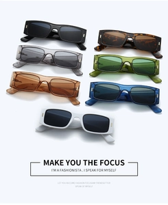 Detail view of seven trendy rectangular sunglasses in various colors with gold metal accents