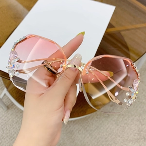 Luxury oversized rimless sunglasses with pink gradient lenses and crystal embellishments