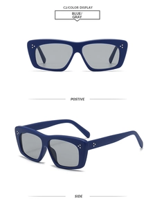 Detail view of rectangular blue sunglasses with silver rivets and matte finish