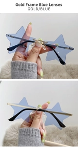 Star shaped rimless sunglasses with gold metal frame and light blue lenses in close-up