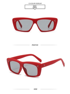 Detail of red cat-eye sunglasses with silver rivet studs and grey lenses from two angles