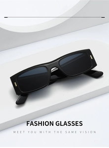Detail of black rectangular sunglasses with golden metal rivets on white geometric stand