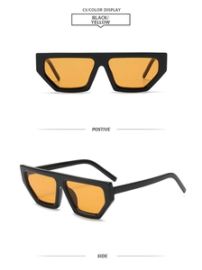 Detail view of bold black geometric rectangle sunglasses with bright yellow transparent lenses
