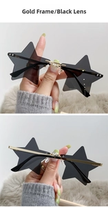 Detail of star-shaped rimless sunglasses with gold metal frame and black lenses