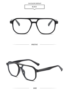 Detail view of black double-bridge eyewear frame with metal rivets and stylish square shape