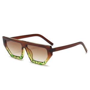 Retro geometric flat top sunglasses with thick amber and tortoiseshell frames and brown lenses