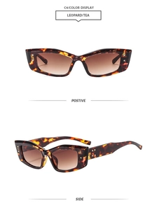 Detail view of leopard print retro sunglasses featuring golden studs and tea gradient lenses