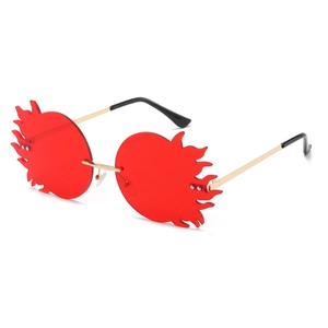 Lunettes de soleil sans monture en forme de flamme avec verres rouges et métal doré