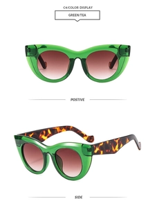 Detailed front and side view of cat eye sunglasses with green frames and tea lenses