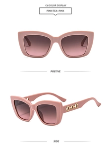 Detail of pink cat eye sunglasses with golden hollow ring decoration on the temples