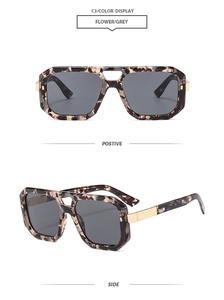 Detail of tortoise shell square aviator sunglasses with gold metal hinges and grey lenses