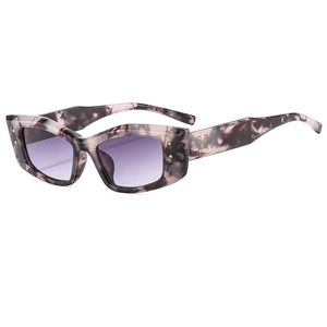 Retro cat-eye sunglasses with purple marble frames and gold metal studs on a white base