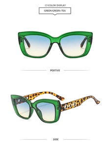 Detailed side view of green cat eye sunglasses with leopard print and metal rings