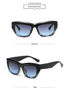 Detail view of square cat-eye sunglasses with black frames and gradient gray-blue lenses