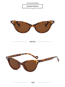 Detail of leopard print cat-eye sunglasses with metal B hinge and brown lenses