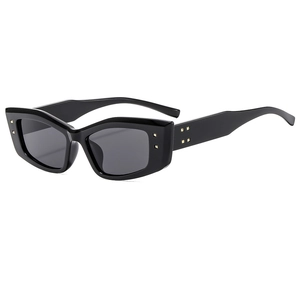 Retro cat-eye sunglasses with thick black frames and gold square rivets in high-gloss finish