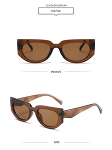 Detail view of tea-colored cat eye sunglasses with thick frames and side hinge profile