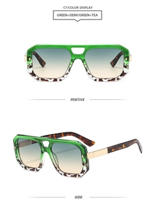 Detail view of square aviator sunglasses with green and demi frames and gradient lenses