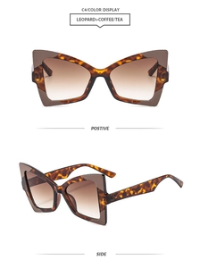 Detail view of butterfly cat-eye sunglasses with leopard print and brown gradient lenses