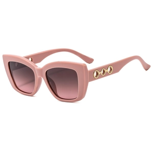 Pink cat eye sunglasses with gradient brown lenses and golden ring temple details