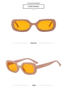 Detail view of rectangular sunglasses with orange and white chevron stripe pattern