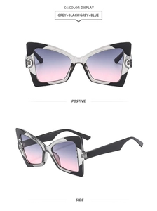 Detailed butterfly frame sunglasses in black and grey with gradient lenses from two angles
