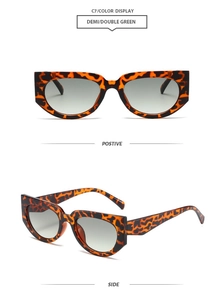 Detail view of cat eye sunglasses featuring demi leopard frames and green gradient lenses