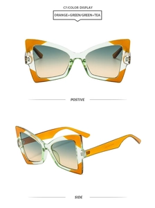 Detail view of butterfly cat-eye sunglasses in orange and green contrast frames