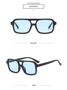 Detail view of vintage square pilot sunglasses with thick black frames and blue lenses